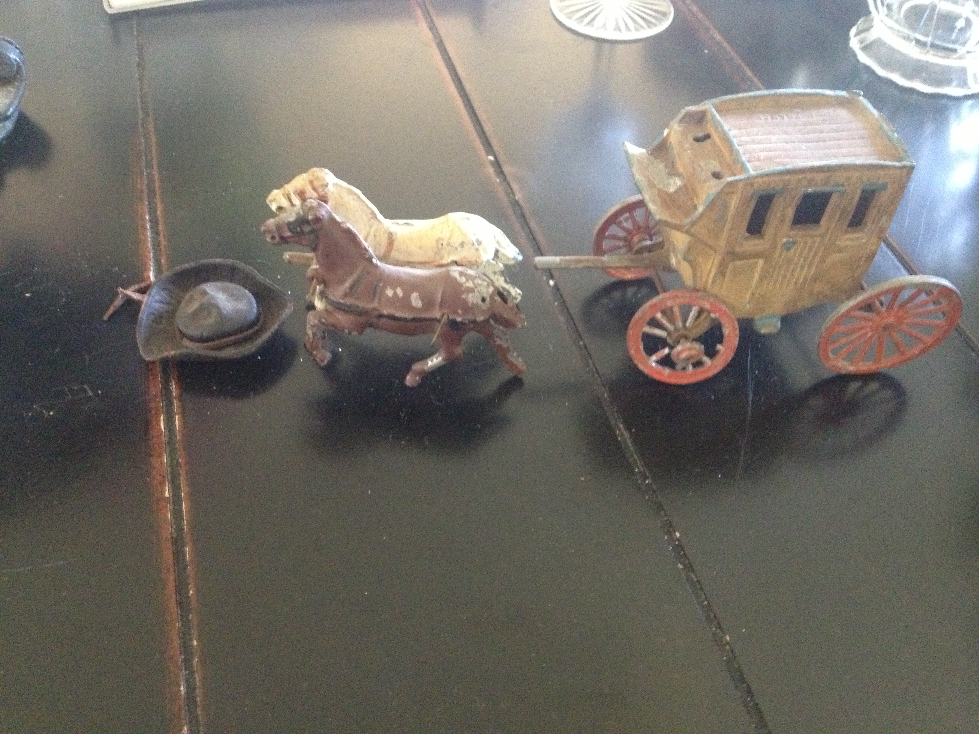 No idea where the cowboy belonging to that hat went. :/ Antique metal horse and wagon toys.