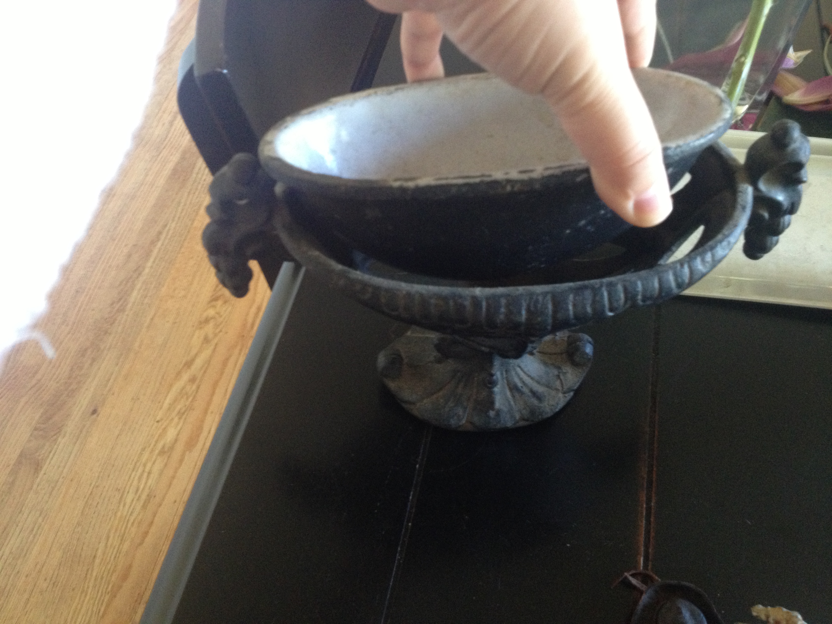 A mysterious iron and enamel antique footed vessel.