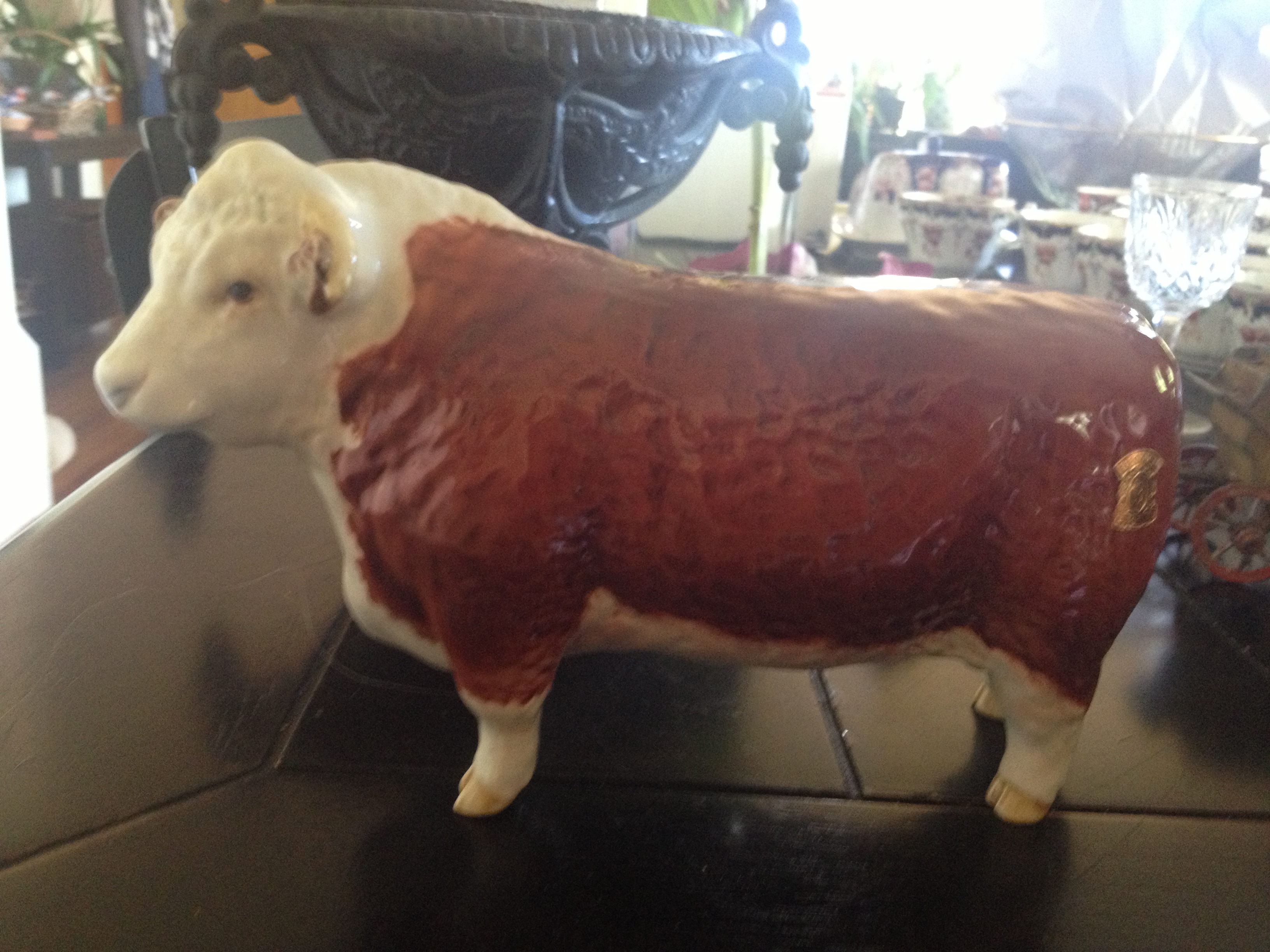 He's made in England, but I inherited him from my non-English family. An antique porcelain bull.